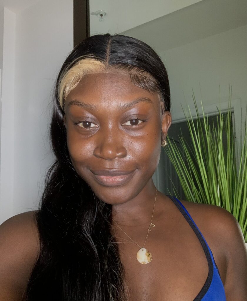 Black woman using the summer Fridays jet lag mask on face