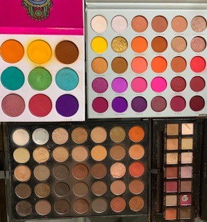 photo of my 5 best everyday eyeshadow palettes: Juvias place Zulu palette, Morphe x Jaclyn hill and 35o palette, Natasha Denona and Anastasia Beverly hills modern renaissance.